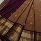Pari is a graceful Kanchipuram pure silk saree in a serene copper-rose gold brown hue. Scattered peacock zari buttas .  Framed by an antique-gold korvai border temple-inspired yali, annam, and floral medallions, finished with a deep wine-maroon Pallu