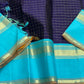 Indigo Teal Kattam – Pure Silk Kanchipuram Saree
Deep Indigo Body with zari Kattam Checks
Teal Contrast Korvai Border with maanga pet and mayil kann border, maanthulir selvedge  , silk mark certified -ships in two weeks