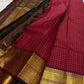 Ruby Zari Kattam – Pure Kanchipuram Silk Saree
Rich Ruby Red Body with Gold Zari Checks
Broad Golden Border with Maroon Highlights & Temple Motifs
Dual-Toned Maroon-Green Pallu with Intricate Zari Weaves

Silk Mark Certified, delivery in 2 weeks