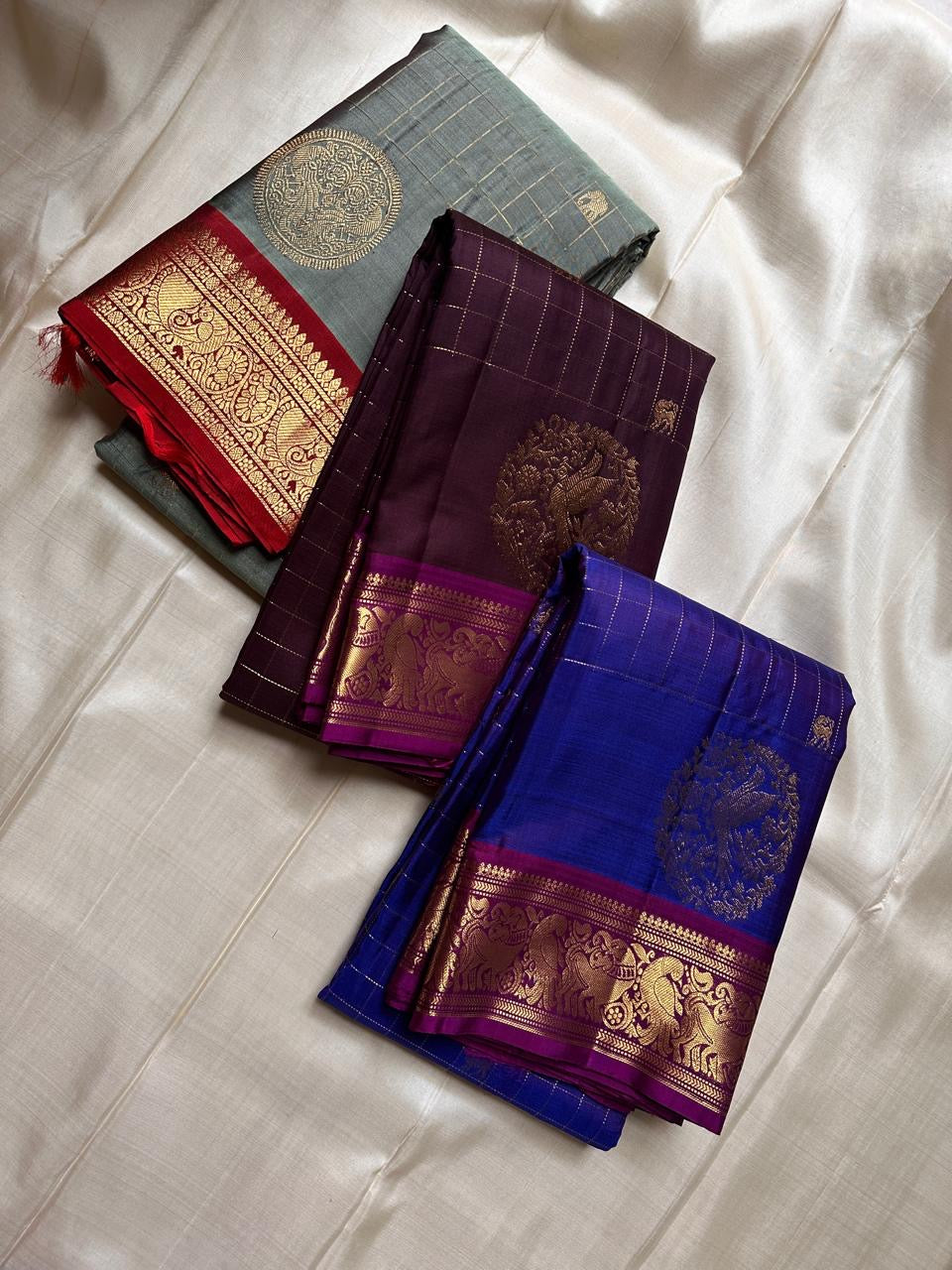 Sorgavaasal Kili , stunning motif in  golden dove grey and red zari kattam zari woven yazhi buttas in pure silk kanchipuram