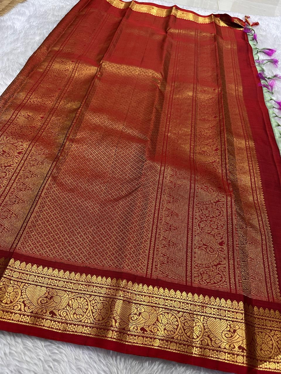Sorgavaasal Kili , stunning motif in  golden dove grey and red zari kattam zari woven yazhi buttas in pure silk kanchipuram