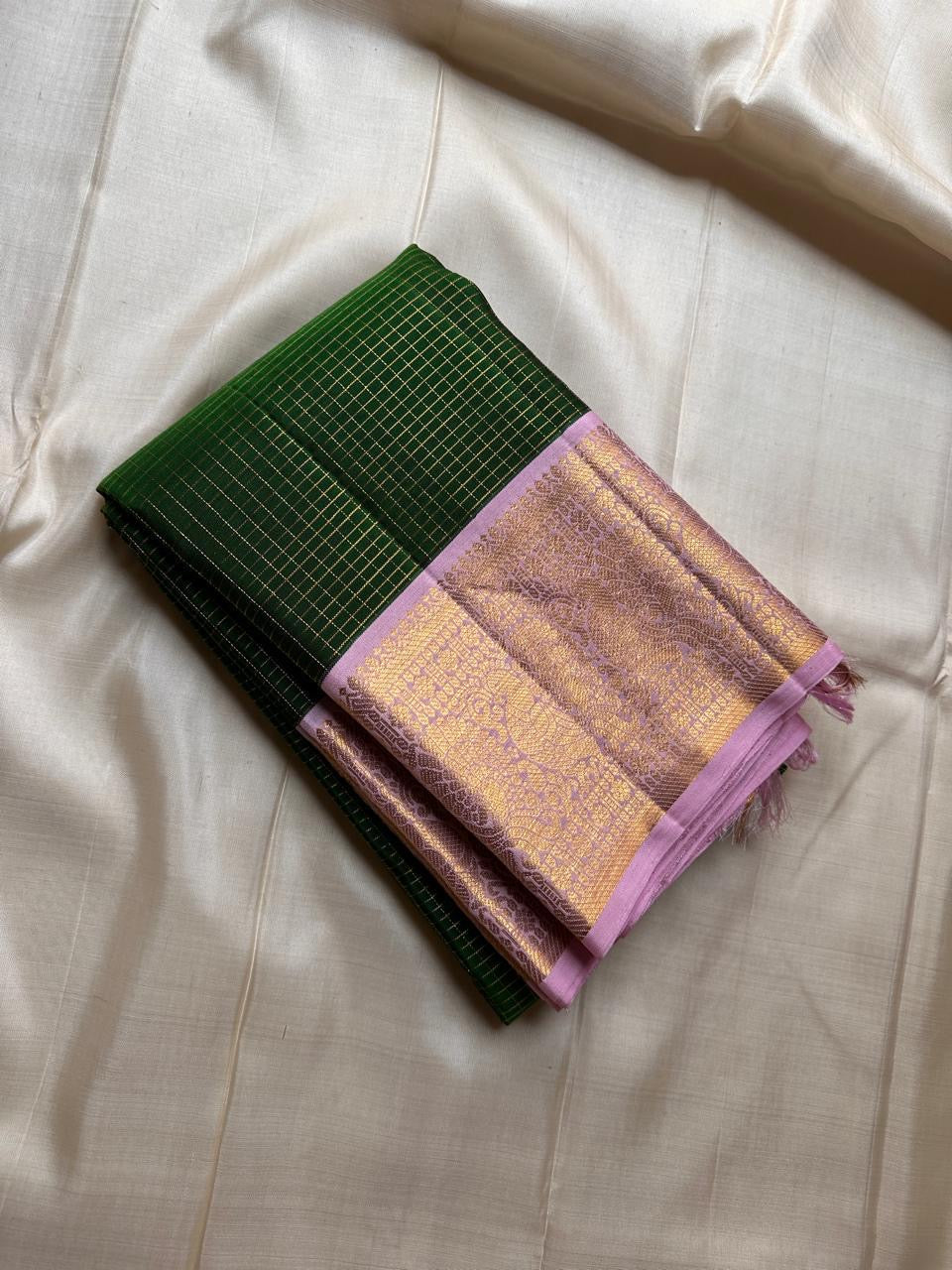 Vibrant green Zari kattam with pastel pink border peacock motif and Pallu