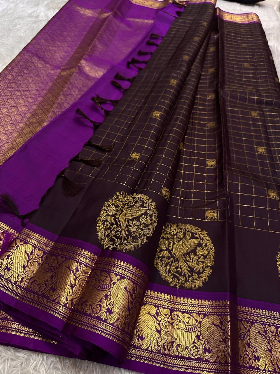 Sorgavaasal Kili , stunning motif in dark brown and purple zari kattam zari woven yazhi buttas in pure silk kanchipuram