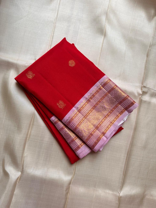 Pure silk flaming cherry red and pastel pink with Zari woven buttas and woven varisaipet Mayil border in pastel pink