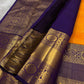 This Maambazha yellow Kanchipuram silk saree features zari mayil buttas and a deep blue rettapet border with kamalam motifs — a timeless blend of tradition and grace.