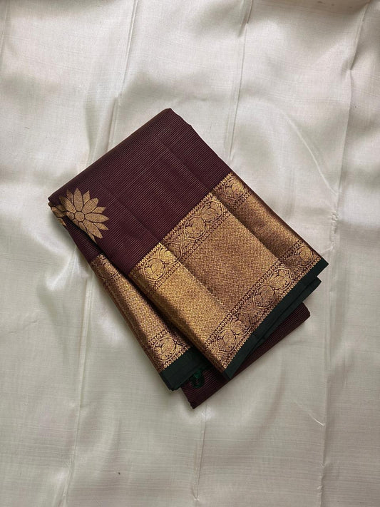 Bronze Lotus Vairaoosi
Coffee-Deep Kanchipuram Silk Saree
Grand Zari Borders • Lotus Butta Elegance