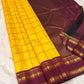 Marigold Yellow & Arakku Pure Silk Kanchipuram Saree
Classic kattam checks across the radiant marigold body
Deep arakku-maroon korvai borders with coin medallion zari
Rich maroon pallu with traditional zari  motifs
Silk Mark Cert • Ships in 2 weeks