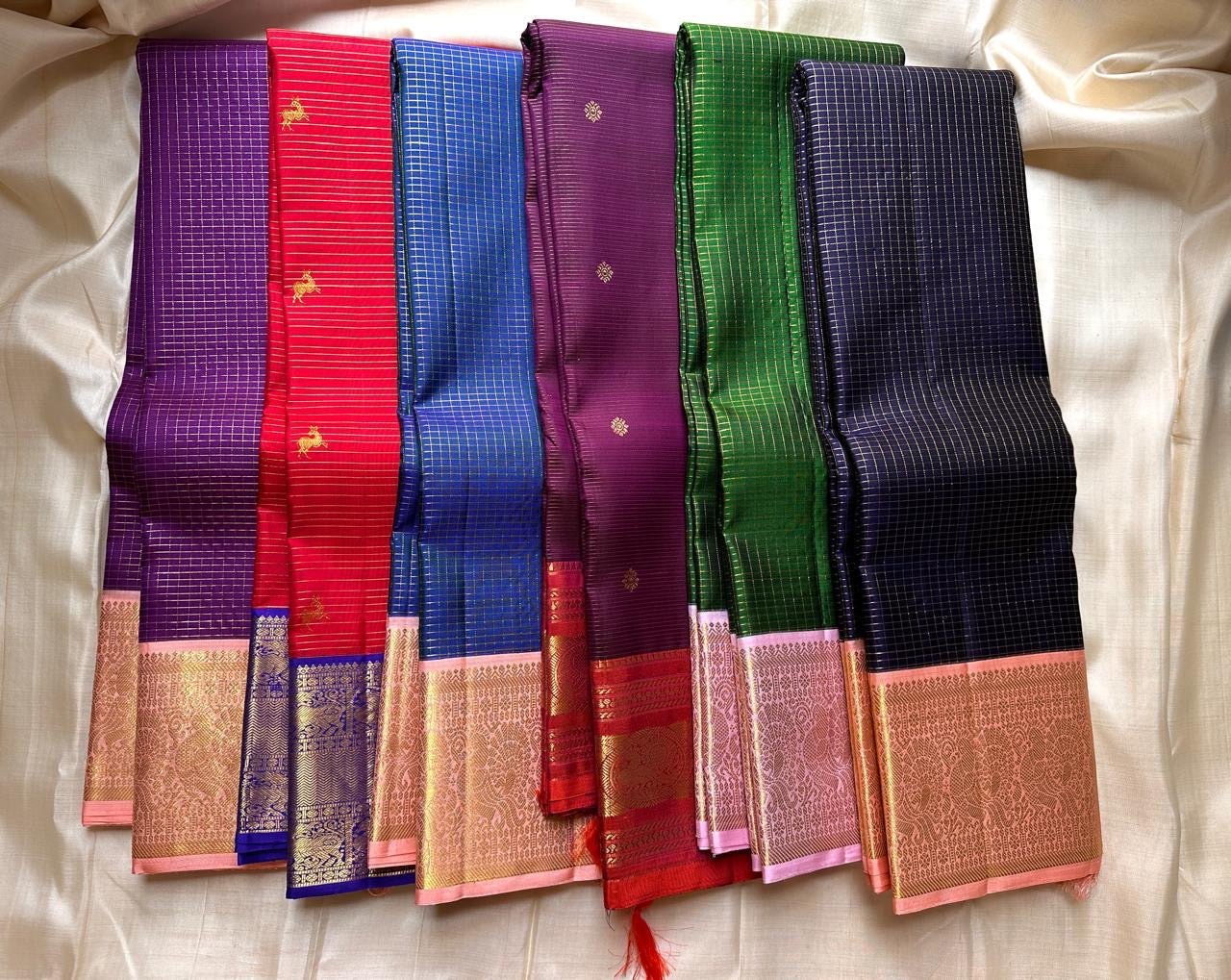 Vibrant green Zari kattam with pastel pink border peacock motif and Pallu