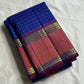 Indra Neelam Kattam – Pure Kanchipuram Silk Saree
Royal Blue Body with Fine Zari Grid Checks
Copper-Rose Korvai Borders with Floral & Chevron Zari
Grand Purple Pallu with Tassels
Silk Mark Certified | ships in 2  weeks | Blouse Stitching Available