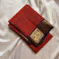 Mantra – Rust brown with coffee brown Kanchipuram Silk Saree with zari Checks with small buttas all over and Antique Peacock zari Border  showcasing regal peacocks and floral vines. A richly detailed pallu completes this heritage Zari kattam