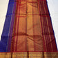 Neela Ratnam — Pure Silk Kanchipuram

• Cobalt-blue kattam checks with antique-gold zari

• Ruby-maroon contrast pallu with grand zari work

• Floral vine borders with bottle-green selvedge

• Silk Mark Certified • Ships in Two Weeks • Free Shipping withi