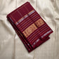 Pankajam 🌺 – Brown maroon Kanchipuram Silk Saree with Zari Kattam, Dashed Lines, Kolam Motifs, Varisaipet Border with Thandavalam Zari Stripes, Rudrakshpet, Annam & Kamalam Motifs, Deep Brown Selvedge & Ornate Pallu