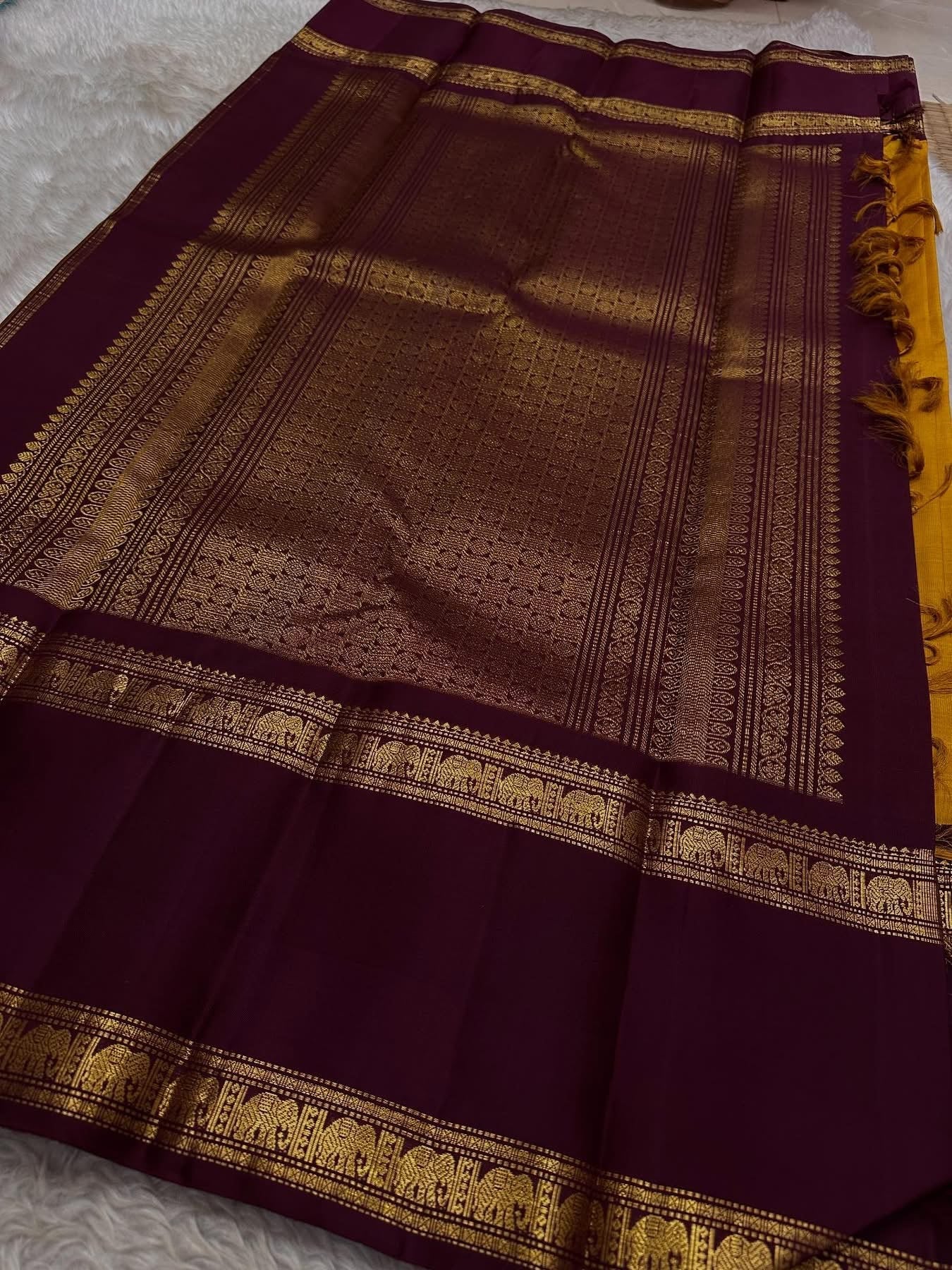 Bhanu – Mustard Gold Handwoven Kanchipuram Silk Saree with Deep Coffee Brown Borders, Intricate Elephant Motif Zari, and a Grand Temple-Inspired Pallu