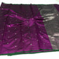 Draped in deep violet and plum, this pure silk Chanderi saree glows with a gentle sheen and graceful vertical zari lines. Delicate diamond meenakari motifs and finely woven borders lend a touch of tradition, with a  contrast green selvedge