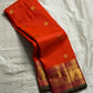 Kalpana  
Pure Silk Kanchipuram Saree  
Burnt Orange with Golden Buttas  
Intricate Magenta & Gold Zari Border