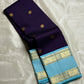Moora – Handwoven Pure Kanchipuram Silk Saree in Deep Regal Purple with Lustrous Contrast Aqua Blue Border and Grand Pallu, Featuring Intricate Gold Zari Weaving with Traditional Round Medallions, Paisley Buttas, and Concentric Floral Vine Patterns