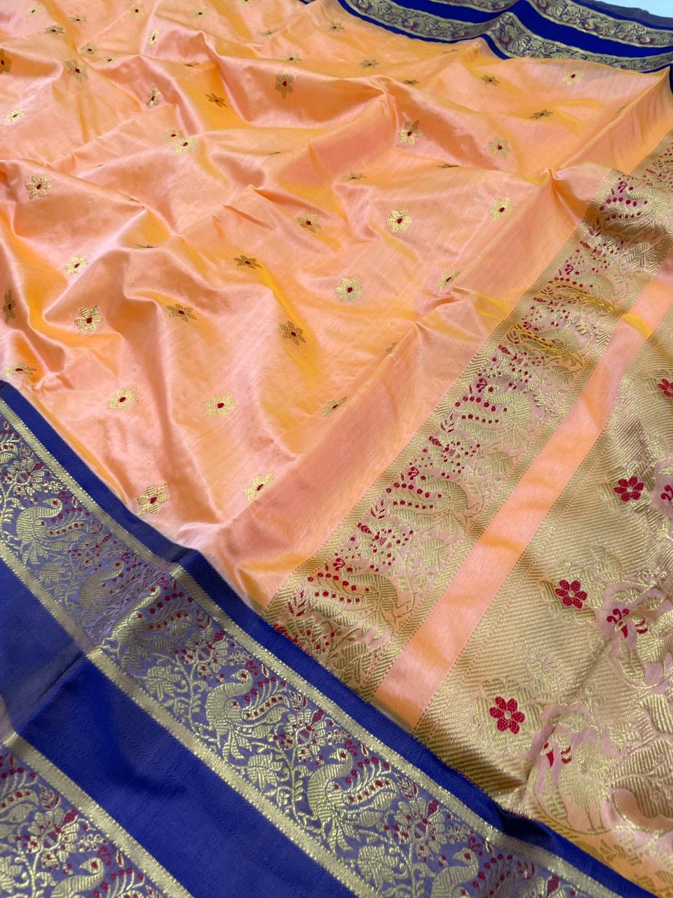 Apricot Peach Pattu Silk Chanderi saree showing Royal Blue border and intricate gold-toned pallu