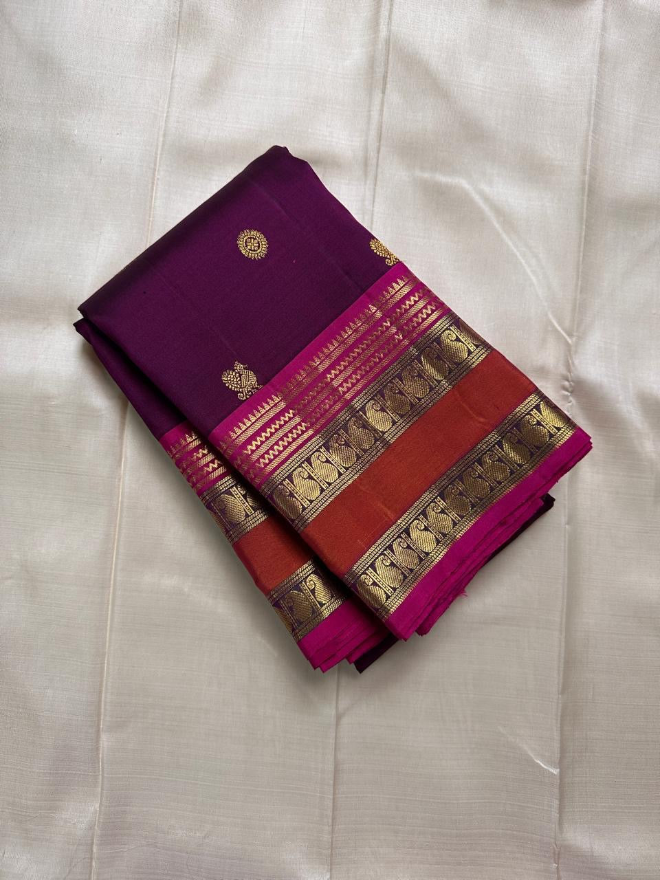 Kavyashree Plum Lustre — Pure Kanchipuram Silk Saree
Deep Plum Body with Gold Buttas, Rust–Magenta Korvai Borders
Silk Mark Certified | Free Shipping within USA | Ships in Two Weeks