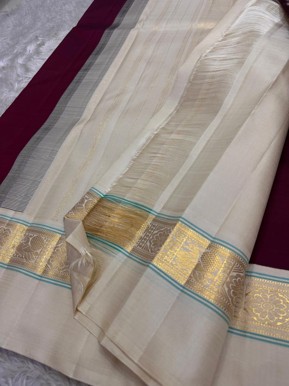 Maroon  Pure Kanchipuram Silk Saree with Kaal Erangina ivory  Zari Border