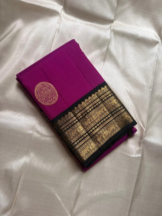 Menaka ✨ Draped in vibrant purple , its body shines with golden Yazhi motifs enshrined in Sorgavaasal arches. The contrasting black Korvai border, alive with elephants, vines, and temple motifs in zari and lavish Pallu , silk mark certified ❤️