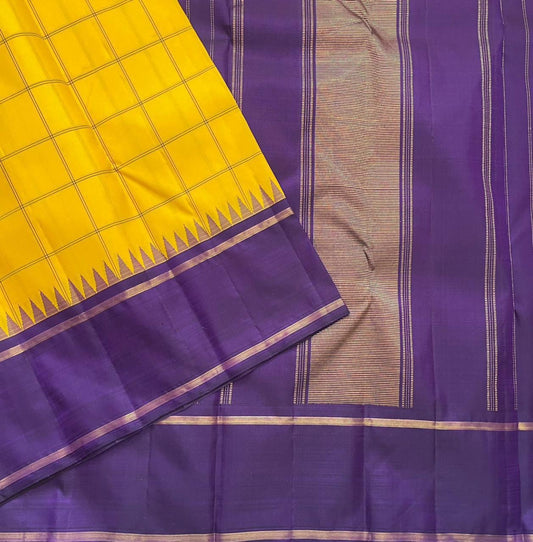 Haldi Violet Kattam Korvai
Pure Kanchipuram Silk Saree – Bright Haldi Yellow Checks with Contrasting Violet Korvai Borders
Minimal zari lines for an elegant look
Grand violet pallu with delicate zari stripes, silk mark certified, ships in 2 weeks