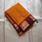 Saffron Royale – Pure Kanchipuram Silk Saree with Peacock Motif Border
Majestic saffron body with delicate zari buttas.
Rich maroon border woven with grand peacock motifs in  zari.
Traditional maroon pallu. Silk Mark Certified, delivery in 2 weeks