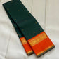 Pachai Kesar Mayil — Kanchipuram Pure Silk

 Bottle-green body with dainty gold floral buttas

Contrast marigold-orange korvai borders with temple edging

Rich gold-zari paisley scrolls; striped orange pallu with tassels

Silk Mark Certified | Free Shipp