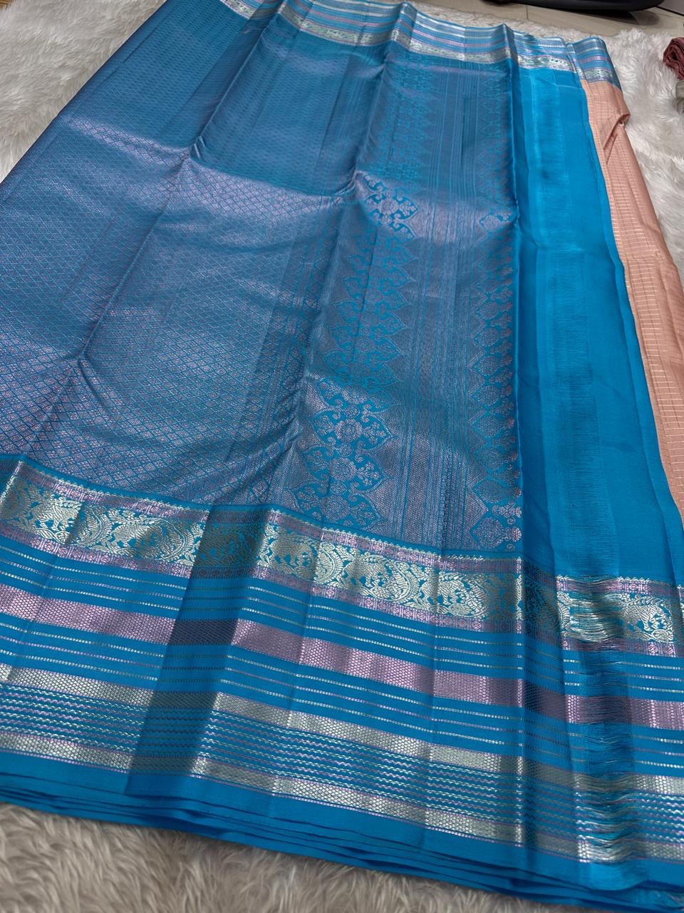 Most unique peach  mocha  and blue combination in pure silk Kanchipuram with Zari kattam and elephant motif border