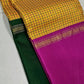 Swarna Kattam Ganga Jamuna — Pure Silk Kanchipuram Saree
Golden mustard kattam checks body • Dual korvai borders in rani pink & emerald green
Rich zari pallu with radiant festive sheen
Contrast emerald blouse with zari selai finish
Silk Mark Certified •