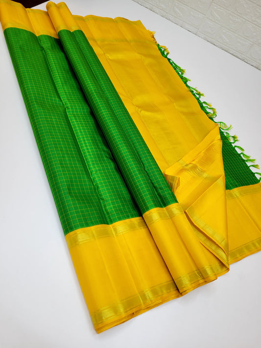 Pure silk kanchipuram bright verdant green with yellow border kattam body and rettapet border with seer Pallu