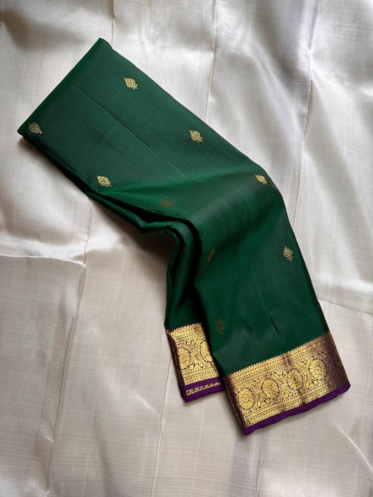 Marakatha Valli ✨ – Pure Kanchipuram Silk Saree
Emerald Green Body with Fine Zari Buttas
Royal Purple Korvai Border with Gold Zari Motifs
Majestic Purple Pallu with Rich Gold Zari Brocade
Silk Mark Certified | Fall & Pico Done | Blouse Stitching ($30) |