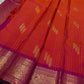 Sharvani – Orange & Magenta Pure Silk Kanchipuram Saree
Featuring zari-woven stripes across the body for subtle structure.
Bold magenta border with rice reed and peacock motifs, finished with a green selvedge.