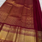 Deep chilli red Kanjipuram Rettapet saree with Bavanji zari border – detail view