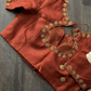 rust-blouse-back-neck-tie-flatlay-view.jpg