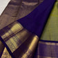 Elaborate royal purple zari pallu on olive green pure silk Kancheepuram saree