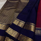 Anuraaga – Neelam

 — Pure Kanchipuram Silk

Vertical Pin-Stripe (Vairaoosi) Body • Gold Coin Buttas

Navy (Neelam) Korvai Border with Elephant Motifs

Diamond-Jaal Brocade Pallu • Running Contrast Blouse

Silk Mark Certified • free shipping in Two Weeks