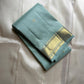 Mint Kattam – Pure Kanchipuram Silk Saree
Pastel Mint Green Body with Fine Zari Checks & Buttas
Broad Gold Zari Border with Textured Tissue Weave
Rich Gold Zari Pallu in Chevron & Striped Bands

Silk Mark Certified, delivery in 2 weeks