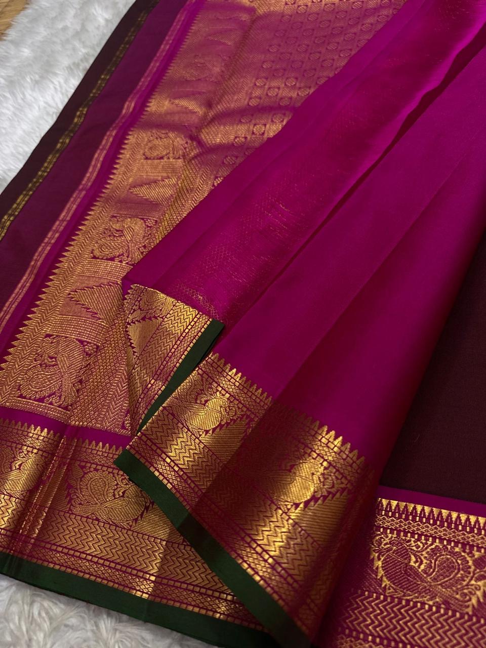 Berry Ruby Kamalam Butta — Pure Kanchipuram Silk
Lotus zari buttas on deep ruby silk with rani korvai border
Silk Mark Certified • Free Shipping within USA • Ships in Two Weeks