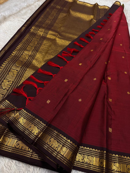 Ember ✨
Pure Kanchipuram Silk Saree in Ember Red & Coffee Brown
Ember-red body with delicate gold zari buttas
Rich coffee-brown elephant border with zari vines

Silk Mark Certified, delivery in 2 weeks