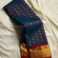 Midnight Neelam Flower Butta — Kanchipuram Pure Silk


Deep midnight neelam (navy) body with scattered gold flower buttas

Korvai contrast maroon borders with grand + geometric zAri motifs 

Rich zari pallū with ornamental motifs; hand-twisted tassels