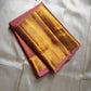 Varnika – Handwoven Kanchipuram Silk Saree in Rose Gold Pink
Graceful and radiant, this rose gold pink Kanchipuram silk saree features delicate gold zari paisleys and Gandaberunda motifs.