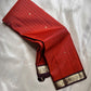 Terracotta Temple – Pure Kanchipuram Silk Saree
Brick red body with fine zari grid checks & golden buttas ✨
Deep coffee-maroon borders and grand diamond-jaal pallu in antique gold.