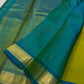 Citrus and Teal – Pure Kanchipuram Silk Saree
Dual-tone body in parrot green and turmeric.
Elegant gold leaf buttas across the drape.
Teal korvai border
Rich teal pallu with diamond jaal and temple motifs.

Silk Mark Certified, delivery in 2 weeks
