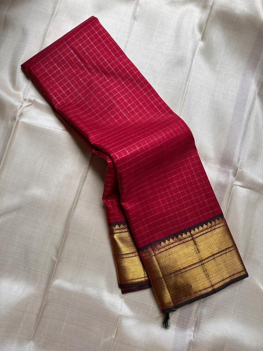 Ruby Zari Kattam – Pure Kanchipuram Silk Saree
Rich Ruby Red Body with Gold Zari Checks
Broad Golden Border with Maroon Highlights & Temple Motifs
Dual-Toned Maroon-Green Pallu with Intricate Zari Weaves

Silk Mark Certified, delivery in 2 weeks