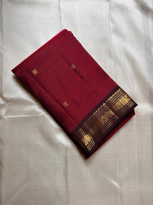 Ember ✨
Pure Kanchipuram Silk Saree in Ember Red & Coffee Brown
Ember-red body with delicate gold zari buttas
Rich coffee-brown elephant border with zari vines

Silk Mark Certified, delivery in 2 weeks