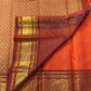 TEJAS – Vibrant Rust Orange Podi Kattam Kanchipuram Silk Saree

Micro-checks body with scattered gold chakram buttas; rich contrast maroon korvai borders

Grand circular annapakshi medallions in lustrous zari; ornate-jaal pallu & tassels

Silk Mark