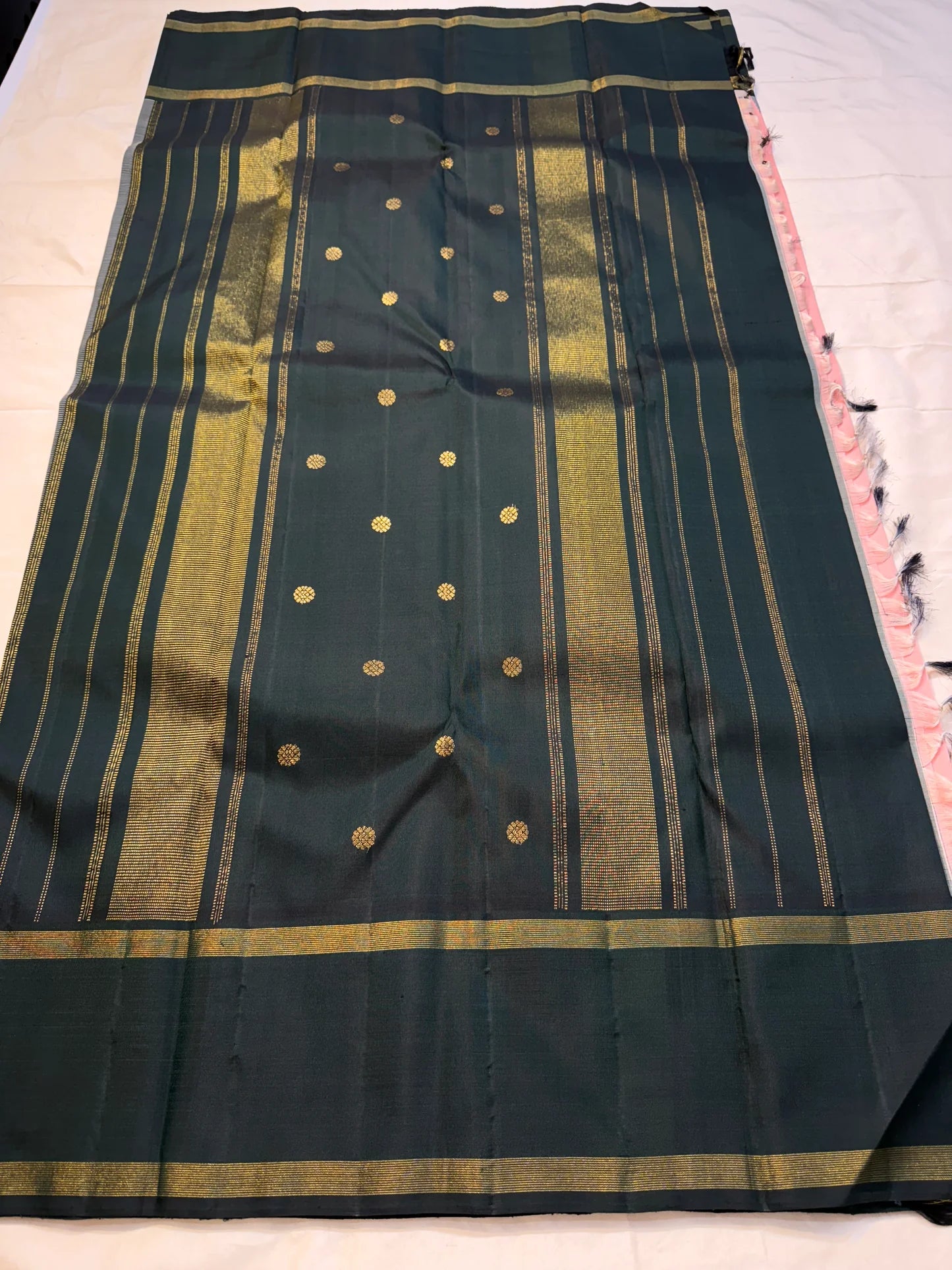 Peach Pastel Pink Pillayar Moggu green korvai Kanchipuram Pure Silk


Soft peach-pink body with delicate gold pillayar moggu & buttas

Contrast deep green pallu with rich zari stripes & coin buttas 

Silk mark , free shipping (USA)  two weeks