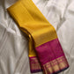 Manjula – Vibrant Yellow Pure Silk Kanchipuram Saree with Handwoven Magenta Benares-Style Dual Border, Maanthulir Green Selvedge, and Intricate Paisley, Rudhraksham & Floral Motifs on Pallu