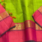 Valli Pachai – Kanchipuram Pure Silk Saree

Parrot-green body in kattam (grid) checks with subtle zari lines

Korvai contrast rani-pink borders featuring gaja (elephant) procession & temple reku motifs

Rich rani-pink zari pallu with vertical bands