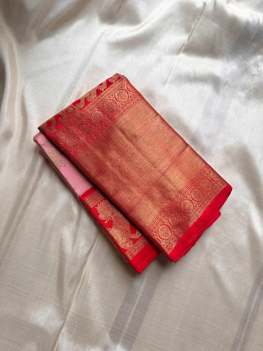 Stuthi ✨ — Vermilion Red Pure Kanchipuram Silk Saree
With Traditional Korvai Weave & Broad Yaali Border
Adorned in Intricate Chakram Motifs & Fine 3G Zari, Grand Zari Brocade Pallu with Medallion Artistry
Contrast red blouse with a broad border